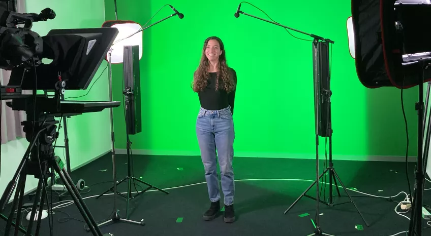 Person in a green screen studio