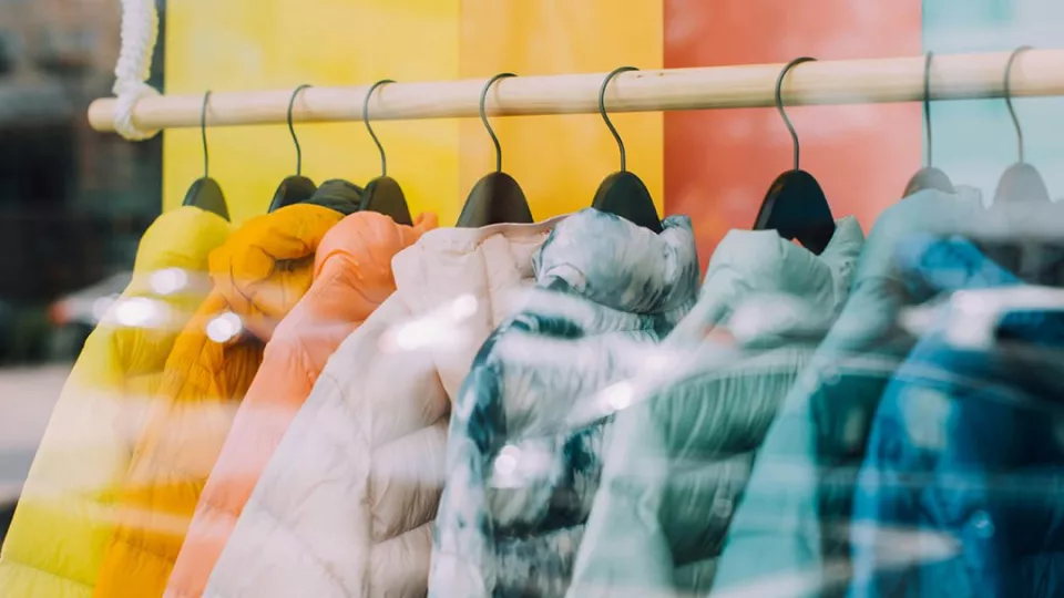 Colourful clothes on hangers