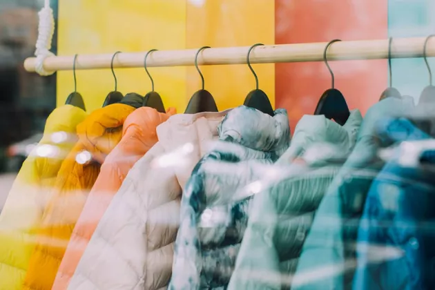 Colourful clothes on hangers