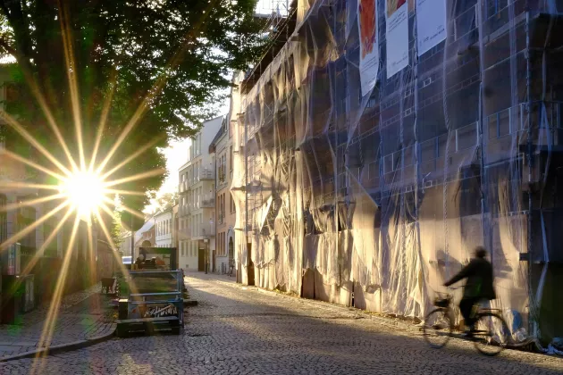 Street in town with sunrays