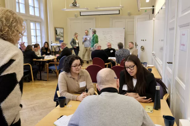 Photo of a room with people in a workshop