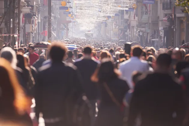 Crowds of people on a narrow street