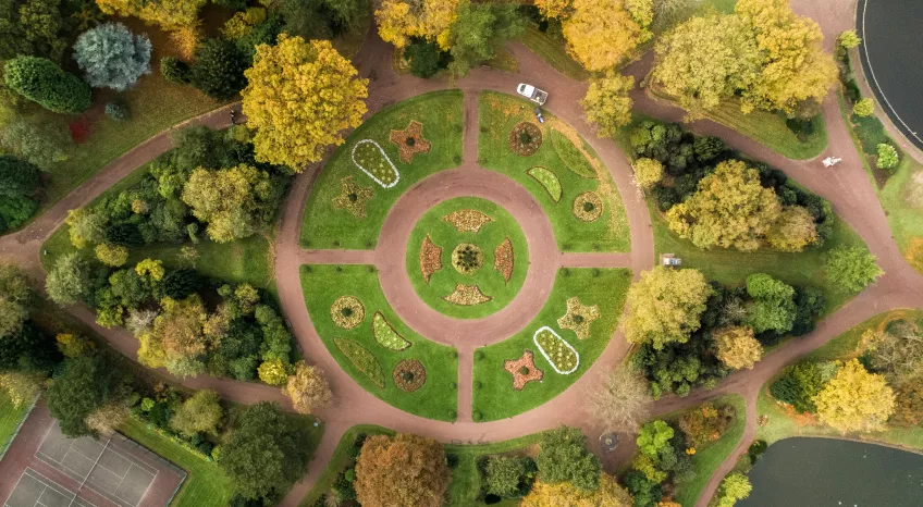 A green pedestrian roundabout is photographed from above.