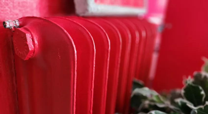 A close up of a bright red radiator